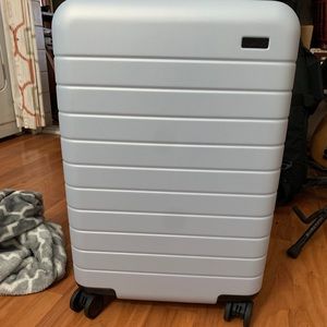 Away carry on luggage with removable battery